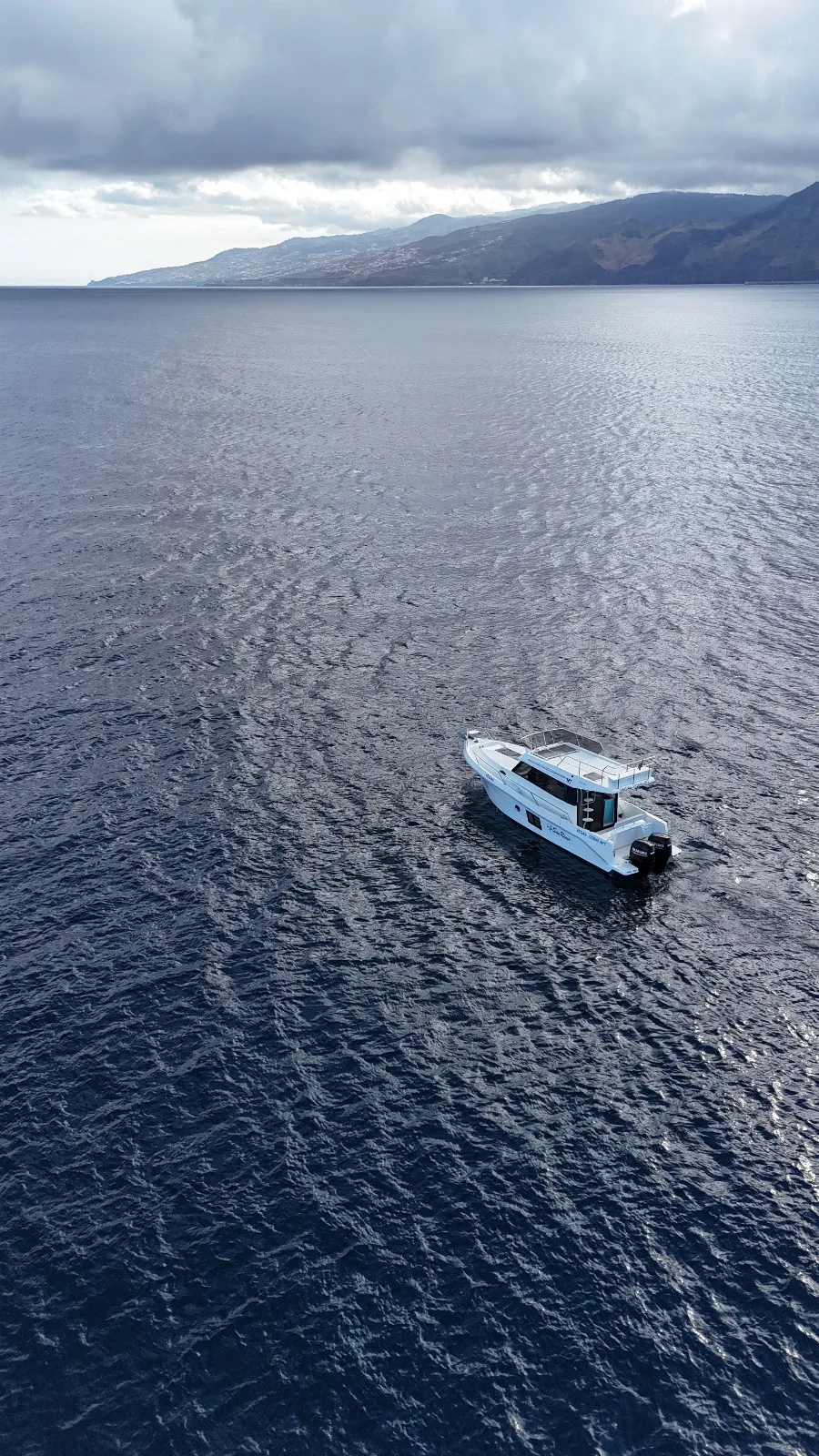 Madeira Charter vessel cruising beside Madeira's coast